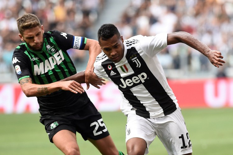 Serie A: Sassuolo forward Domenico Berardi battling for the ball against Juventus's Alex Sandro