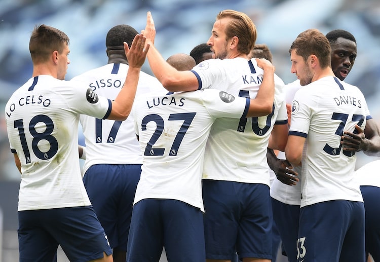 Harry Kane celebrates with teammates after scoring against Leicester City in the Premier League