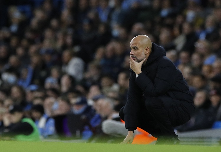 Pep Guardiola watching Manchester City win their Premier League match versus Leeds United