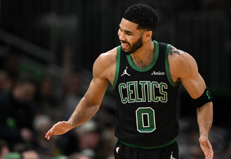 The Celtics defeated the Bucks 111-105 in the NBA, improving to 19-4, with Jayson Tatum scoring 34 points